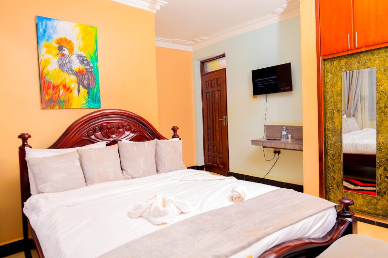 Deluxe guest room with carved bed